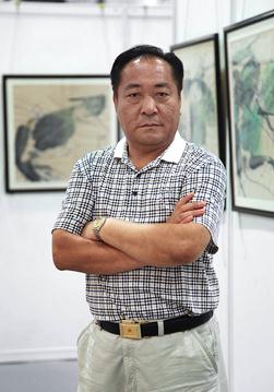 文心的密码 --简评韩志冰的彩墨荷花作品